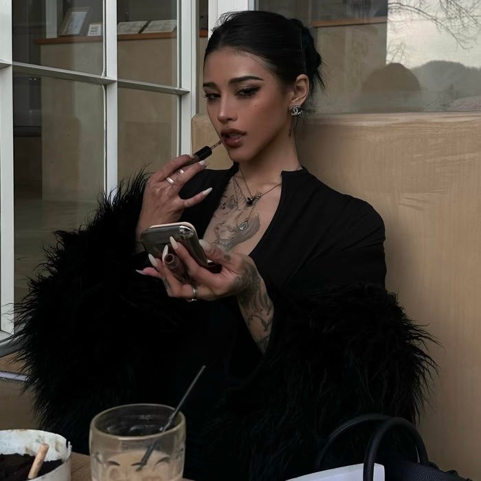 Bold gold accents contrasting dark toned drippy pfp