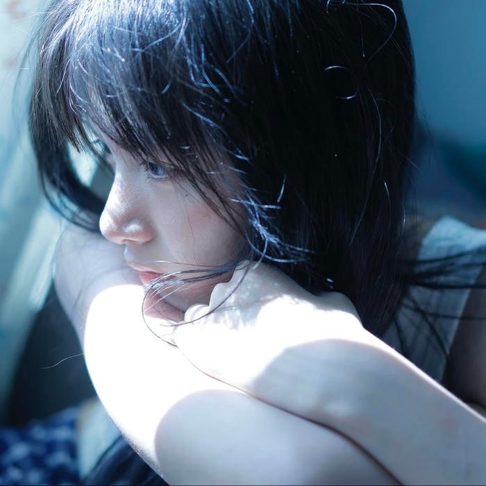 Gentle shadow fall across pfp sad features