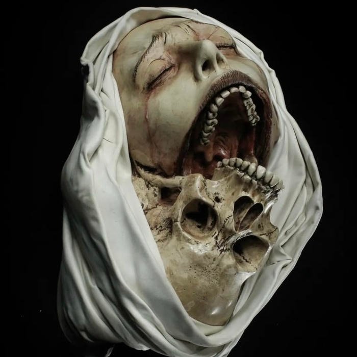 Pale lifeless face illuminated softly in horror pfp