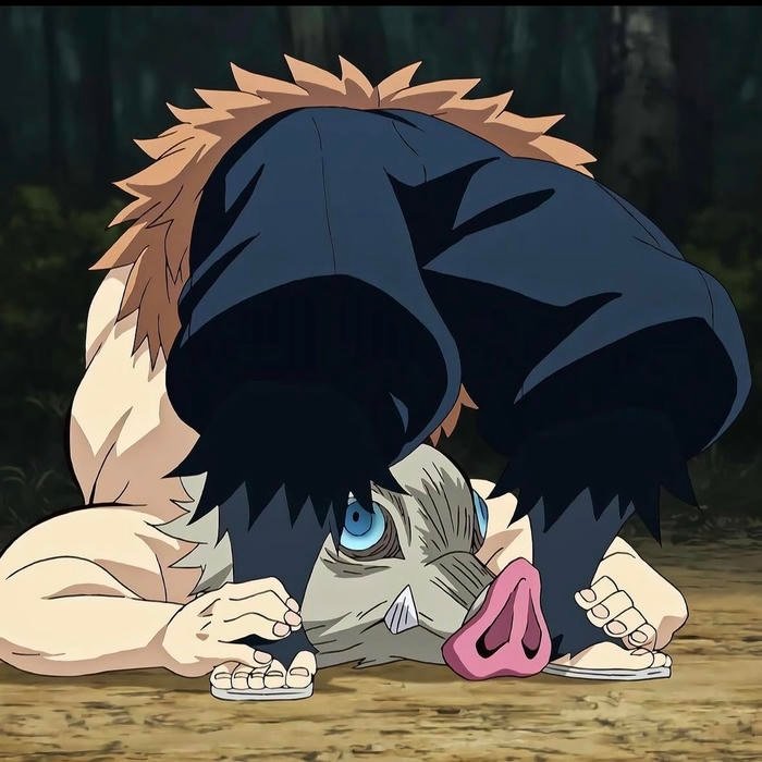 Piercing bright eyes visible beneath boar mask Inosuke pfp